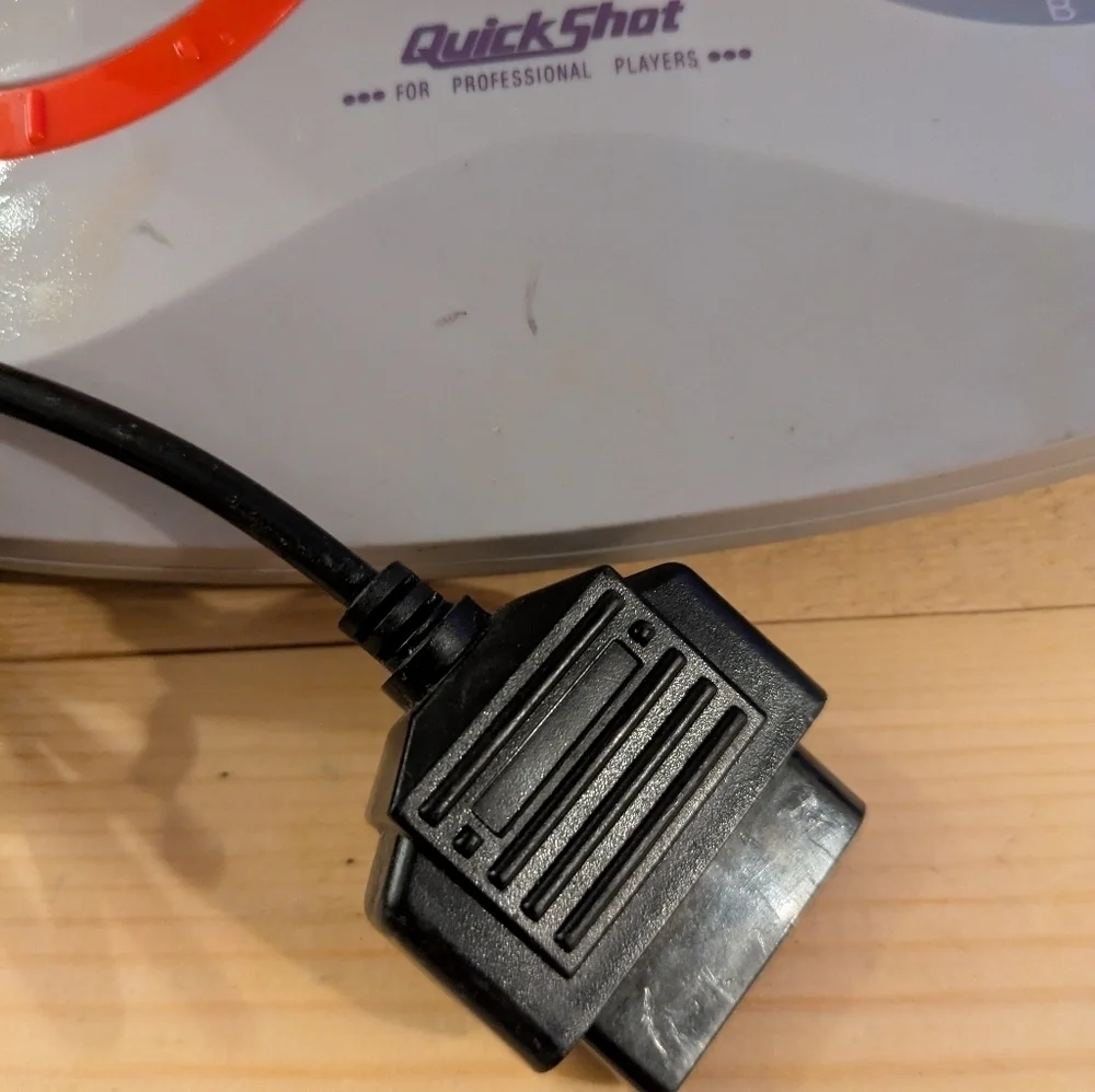 Gray and Red Joystick Controller